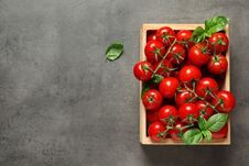 Crate With Fresh Cherry Tomatoes On Stone Background. Space For Text Royalty Free Stock Photography
