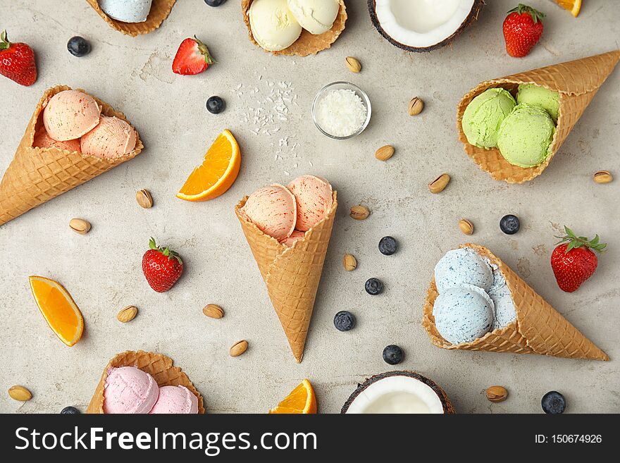 Flat lay composition with delicious ice creams in waffle cones