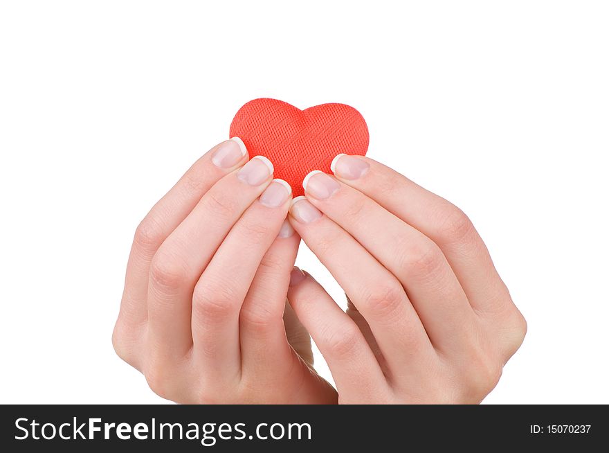 Heart in female hand. Isolated on white. Heart in female hand. Isolated on white.