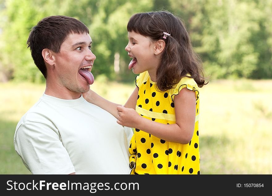 The father with the daughter on the nature. The father with the daughter on the nature