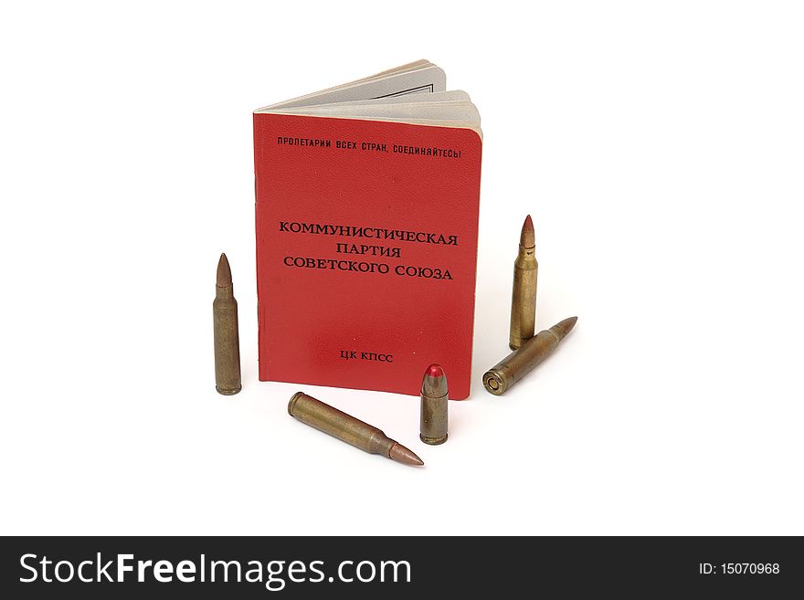 Soviet communist party membership card stands surrounded by cartridges isolated. Soviet communist party membership card stands surrounded by cartridges isolated