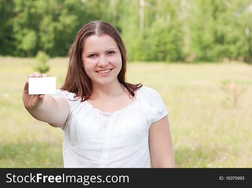 Beautiful woman holding a business card. Beautiful woman holding a business card