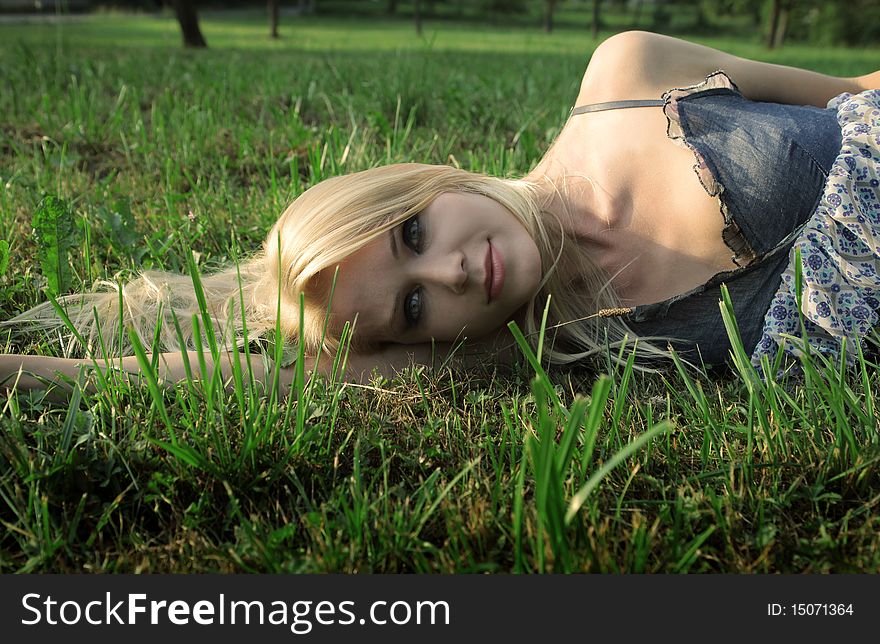 Beautiful woman lying on the grass. Beautiful woman lying on the grass