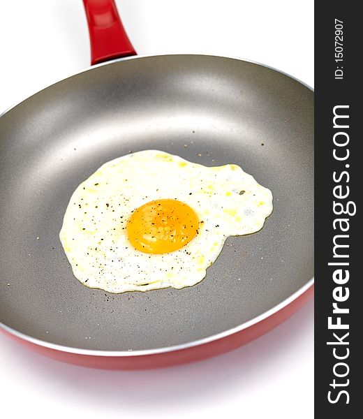 A freshly fried egg in a frying pan