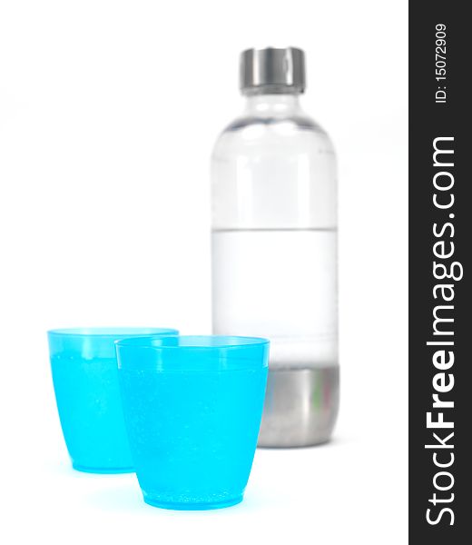 Plastic cups filled with carbonated water isolated against a white background. Plastic cups filled with carbonated water isolated against a white background