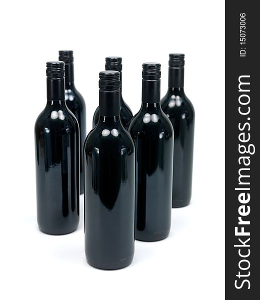 Bottles of red wine isolated against a white background. Bottles of red wine isolated against a white background
