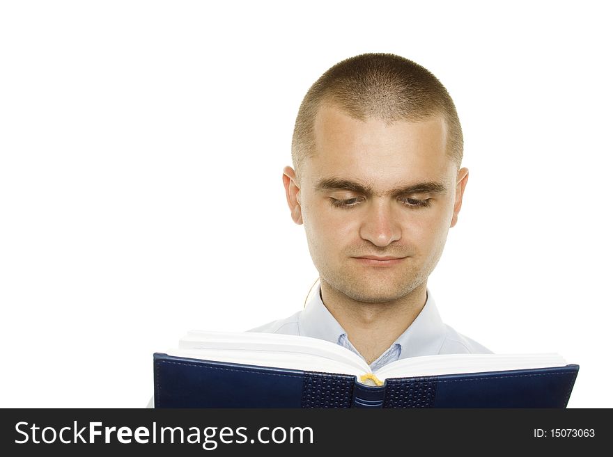 Portrait of a young man holding a blue notebook on white background