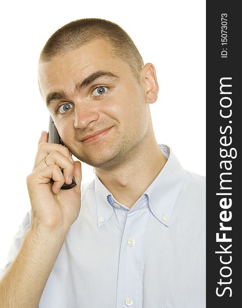 Close-up of young businessman talking on the phone on a white background. Close-up of young businessman talking on the phone on a white background