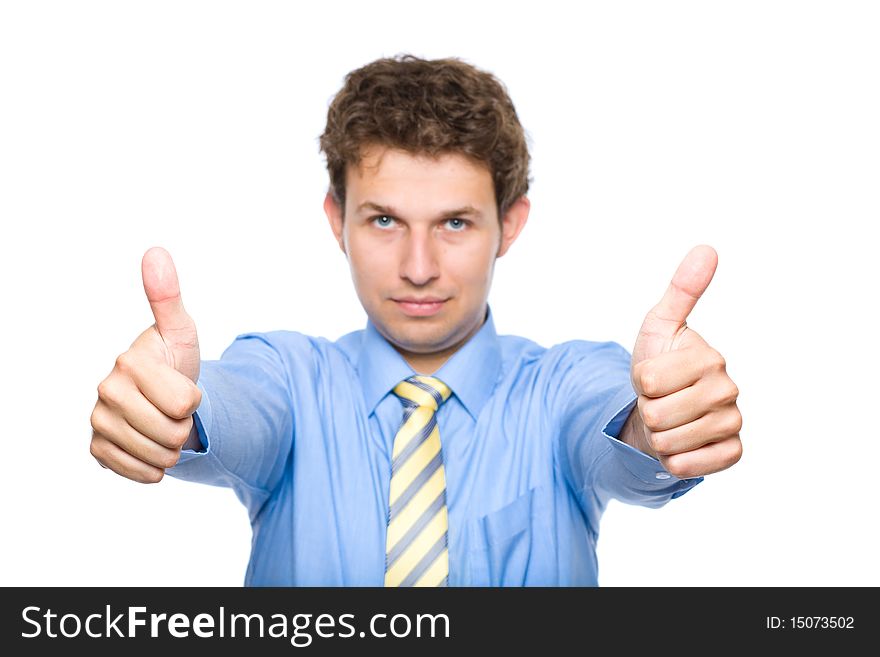 Young male wearing blue shirt and yellow necktie shows thumb up gesture, studio shoot isolated on white. Young male wearing blue shirt and yellow necktie shows thumb up gesture, studio shoot isolated on white