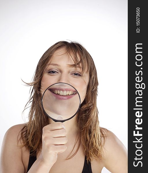 Portrait of woman with magnifier lens