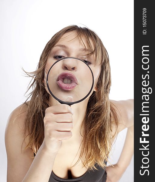 Portrait of woman with magnifier lens