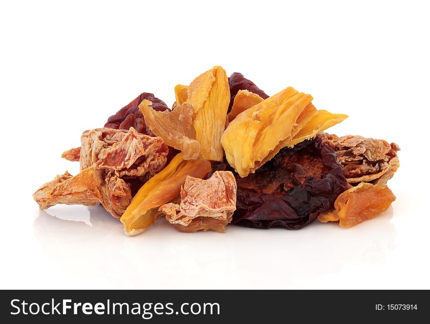 Tropical dried fruit mixture of mango, pineapple, papaya and pluot plum, isolated over white background. Tropical dried fruit mixture of mango, pineapple, papaya and pluot plum, isolated over white background.