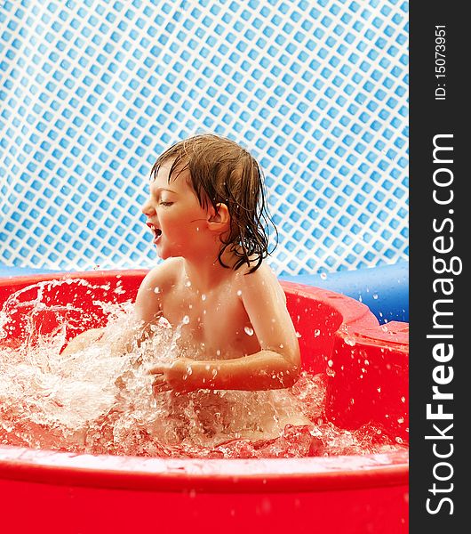 Little Girl Playing In Basin