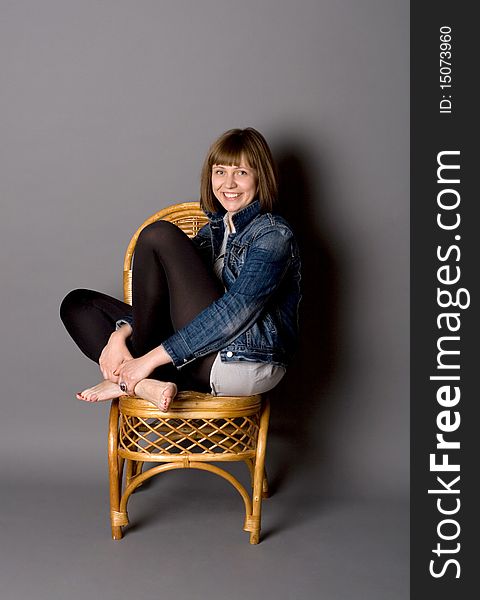 Attractive girl sitting on chair. Attractive girl sitting on chair