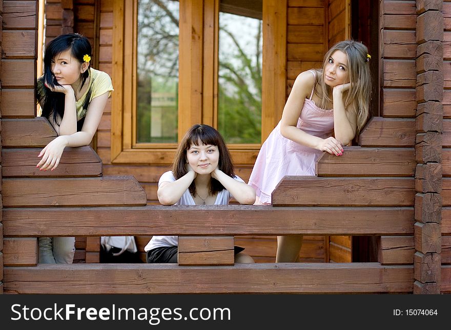 Three female friends on a veranda
