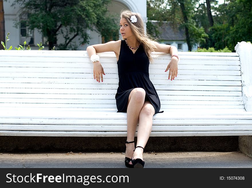 Girl Sitting On Bench