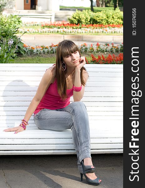 Girl sitting on bench outdoor