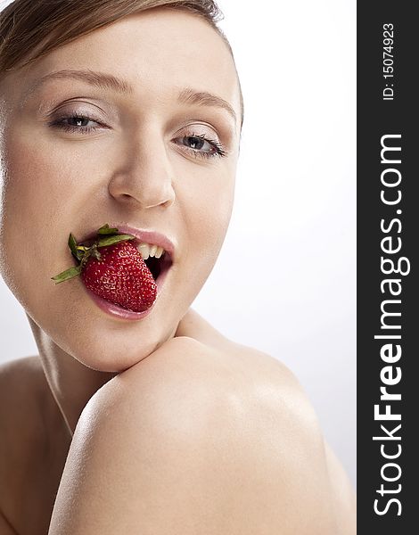 Portrait of woman with strawberry