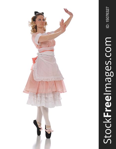 Ballerina wearing a pink dress and isolated on a white background. Ballerina wearing a pink dress and isolated on a white background