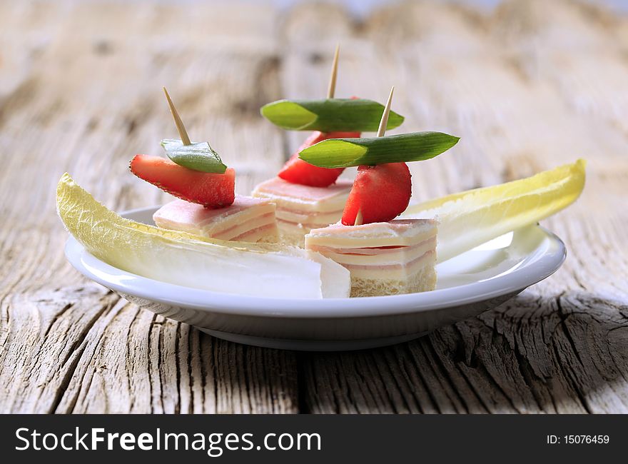 Ham and cheese canapes and endive - detail