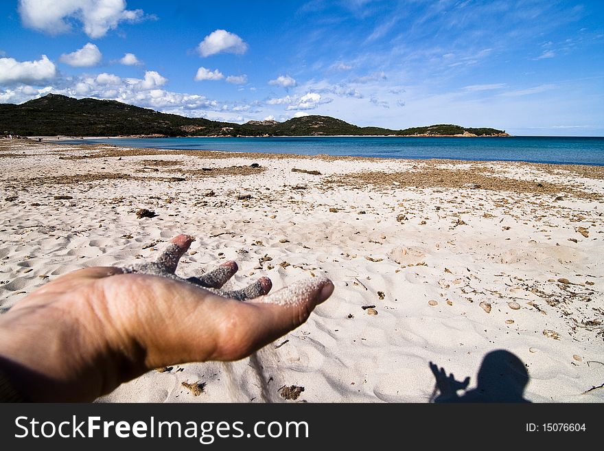 Sea Sand slips from a hand. Sea Sand slips from a hand