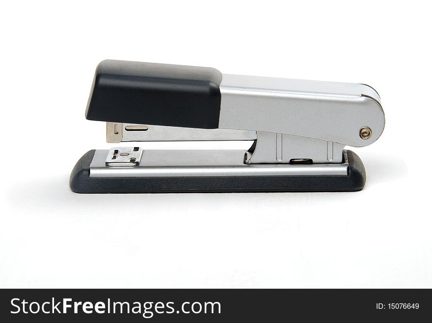 Individual silver stapler on white background