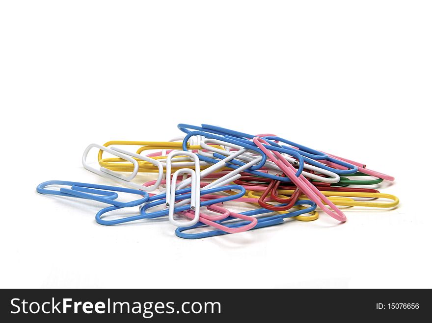 Stack of brightly coloured paper clips isolated on white background. Stack of brightly coloured paper clips isolated on white background