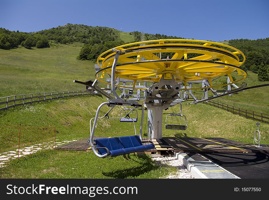 Chair lift with a comfortable chair, in italian alps