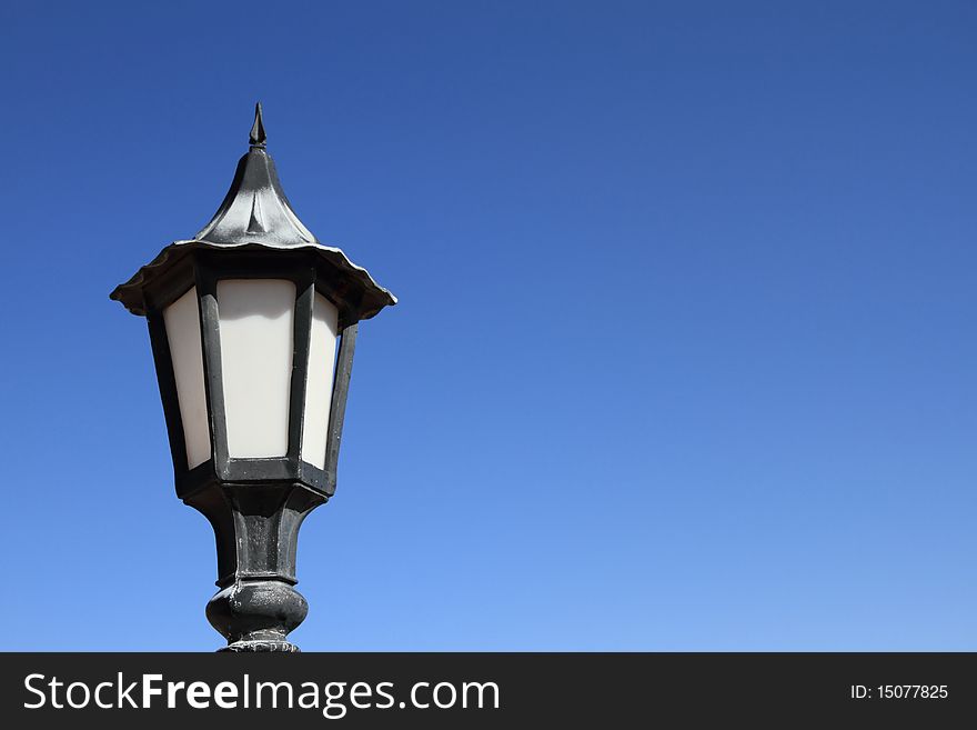 Lamp Post Against Blue Sky