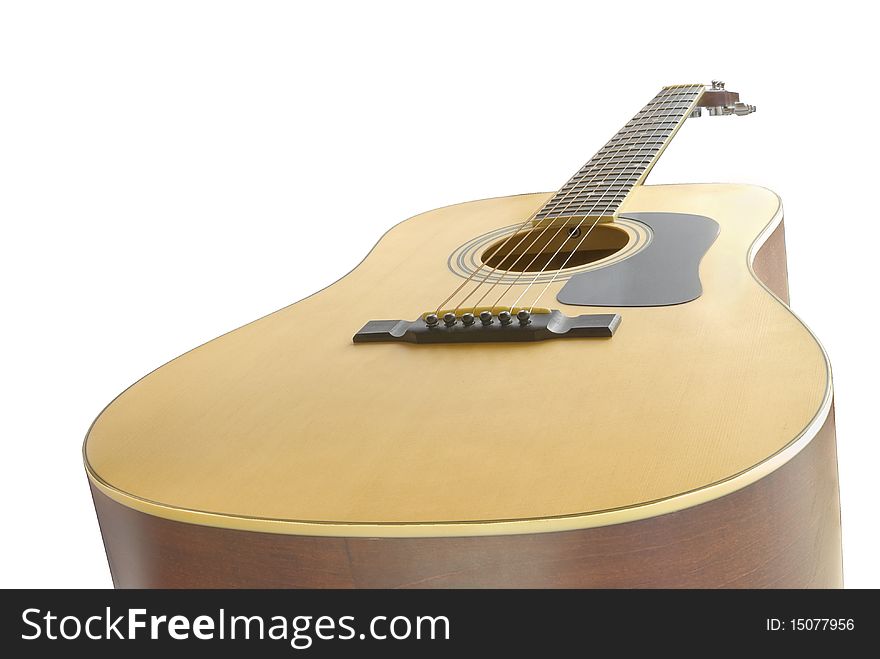 Classic styled and wooden acoustic guitar. Isolated on white background. Classic styled and wooden acoustic guitar. Isolated on white background.