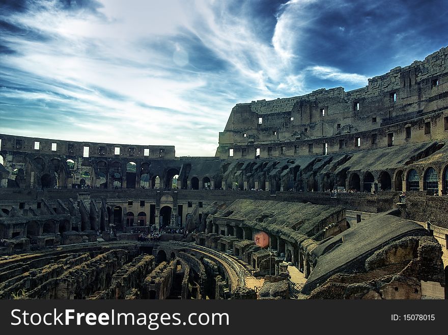 Inside of Colosseum and dramatic sky hdr