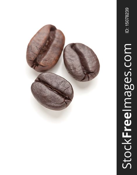 Three Roasted Coffee Beans On White