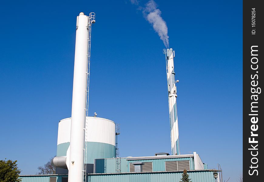 Factory plant building with a chimney modern industry background