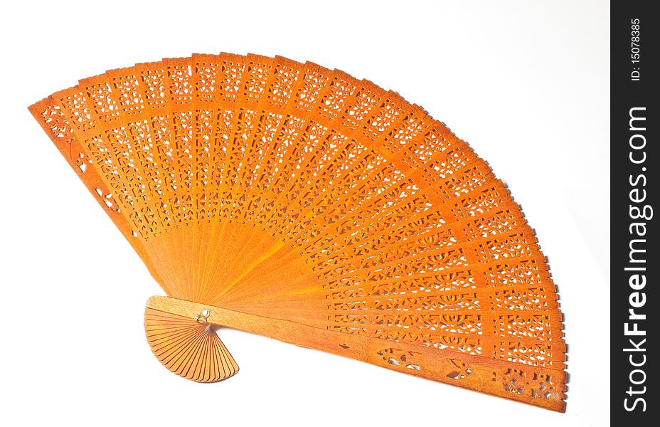 Brown wooden fan with beautiful pattern texture