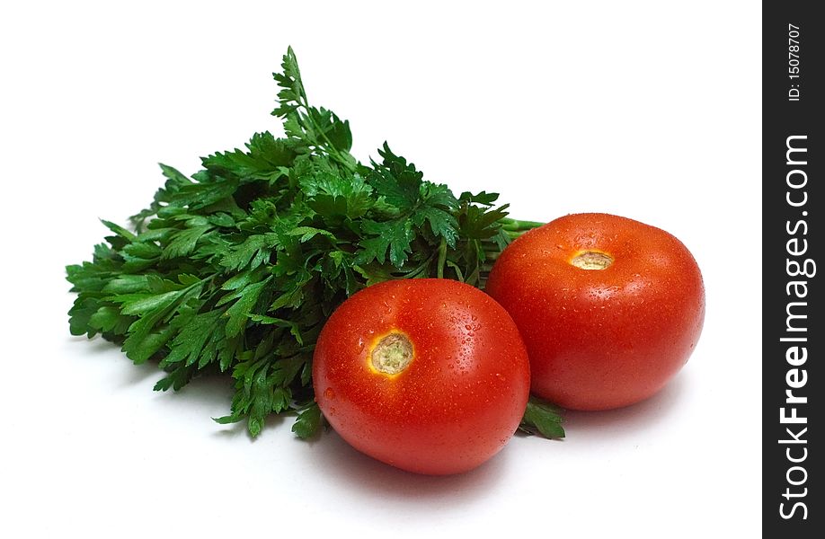 Bunch of fresh parsley and two tomatoes isolated on a white background