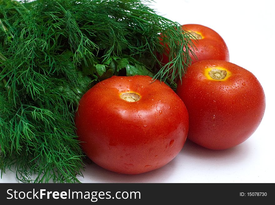 Bunch of fresh herb and tomatoes isolated on a white background