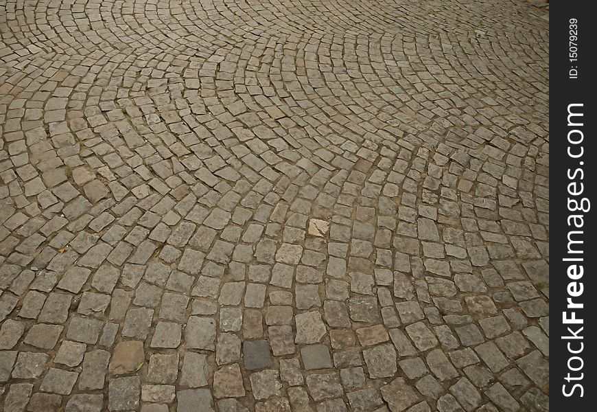 Stone as raw material for the construction of roads, streets, sidewalks, and background and texture