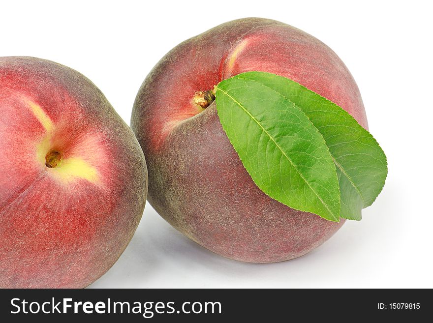 Two peaches isolated on white