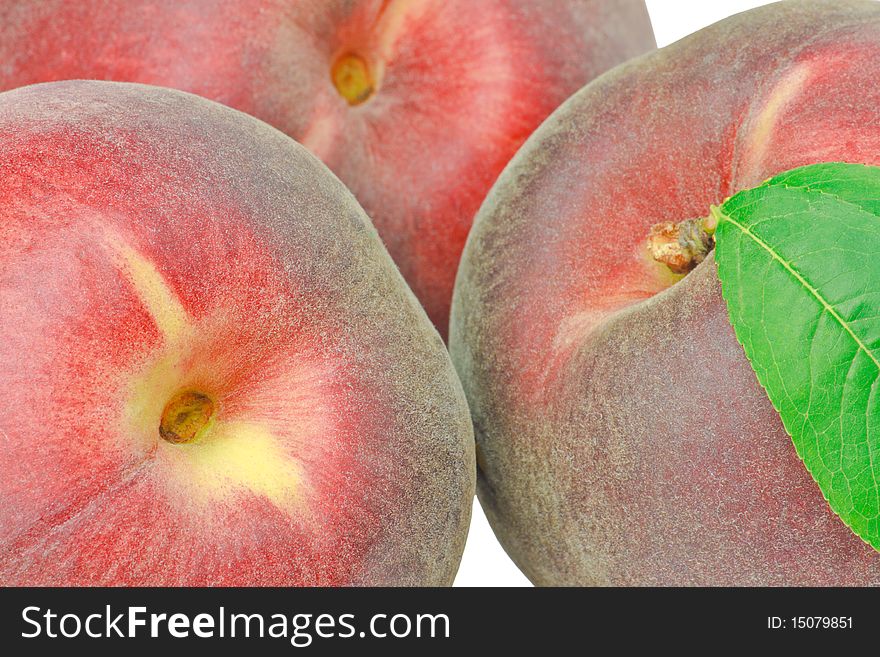 Three peaches isolated on white