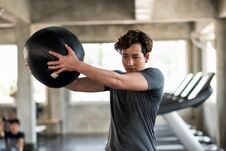 Man Swing Medicine Ball In Fitness Gym Royalty Free Stock Photos Man Swing Medicine Ball In Fitness Gym Royalty Free Stock Photos