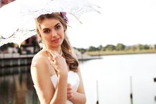 Young Woman Holding A Parasol By The Water Royalty Free Stock Photo Young Woman Holding A Parasol By The Water Royalty Free Stock Photo