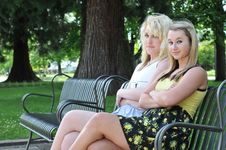 Two Girl Friends Sitting On A Bench Stock Photos Two Girl Friends Sitting On A Bench Stock Photos