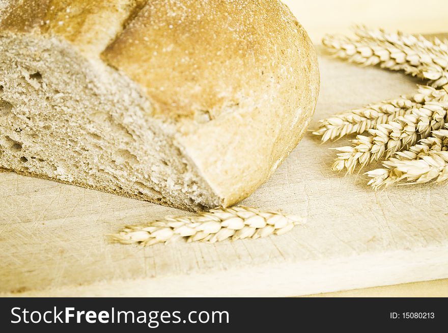 Bread and ears of wheat close up shot