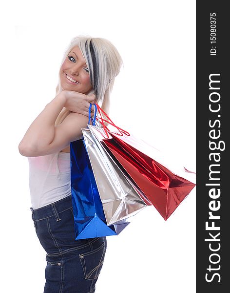 Photograph showing beautiful blond girl isolated against white with shopping bags. Photograph showing beautiful blond girl isolated against white with shopping bags