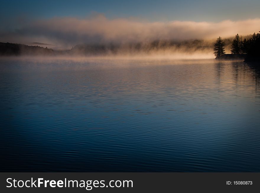 This is a twilight on a lake soon in the morning. This is a twilight on a lake soon in the morning.