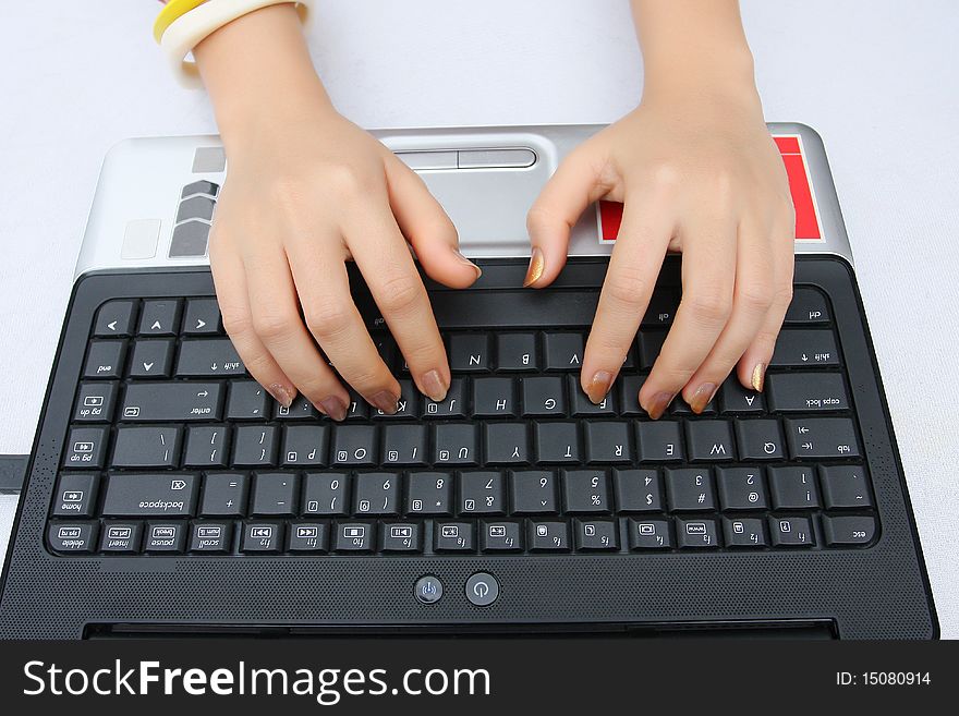 Someone is working with laptop on the table. Someone is working with laptop on the table