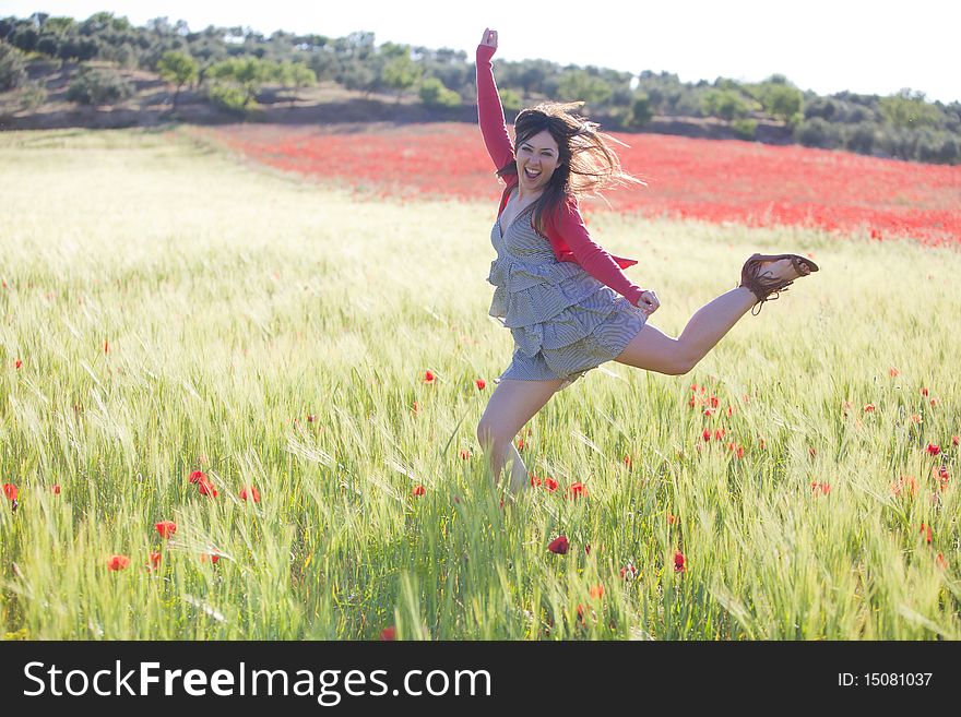 Young girl feeling freedom in green field. Young girl feeling freedom in green field.