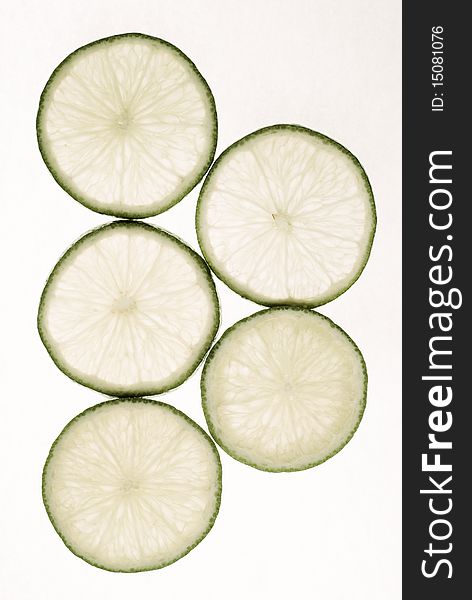 Limes slices on white background