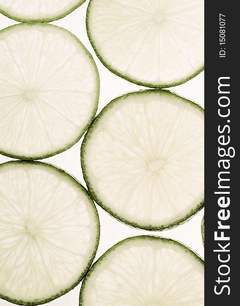 Limes slices on white background