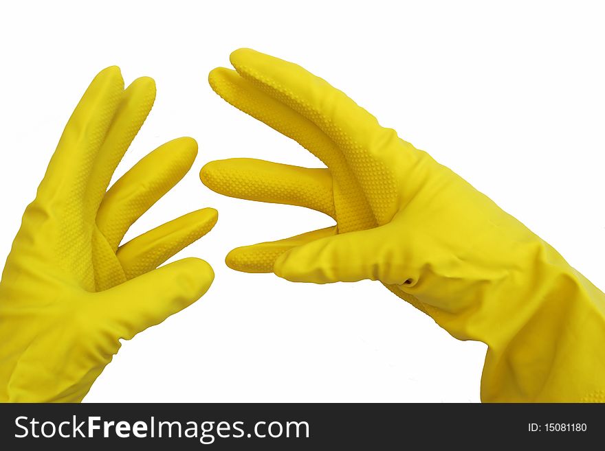 A pair of yellow rubber gloves on hands